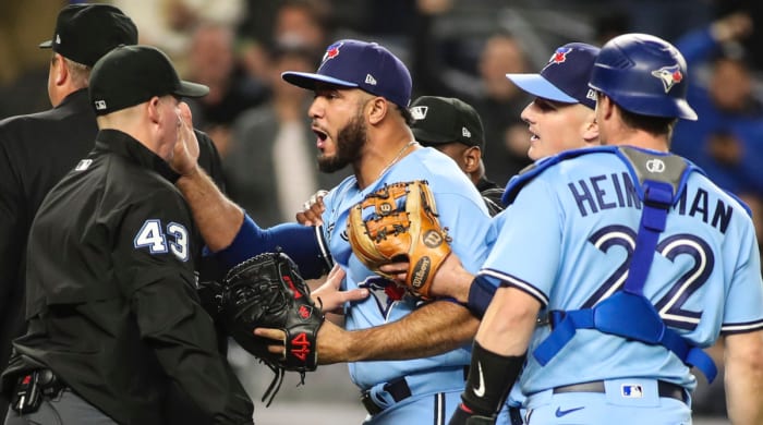 Toronto Blue Jays relief pitcher Yimi Garcia (93) argues with umpire Shane Livensparger (43) after being ejected in the sixth inning against the New York Yankees at Yankee Stadium.